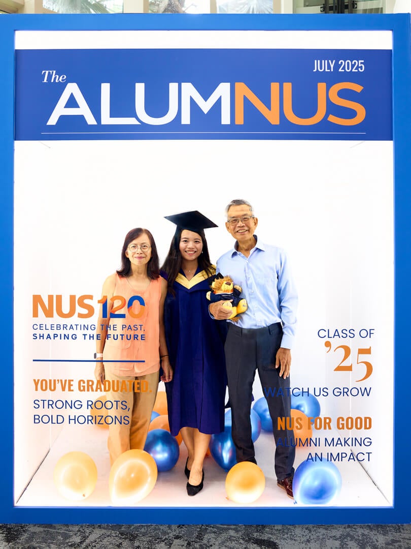 Graduates pose with their friends and family in the photo booth provided by the NUS Office of Alumni Relations.