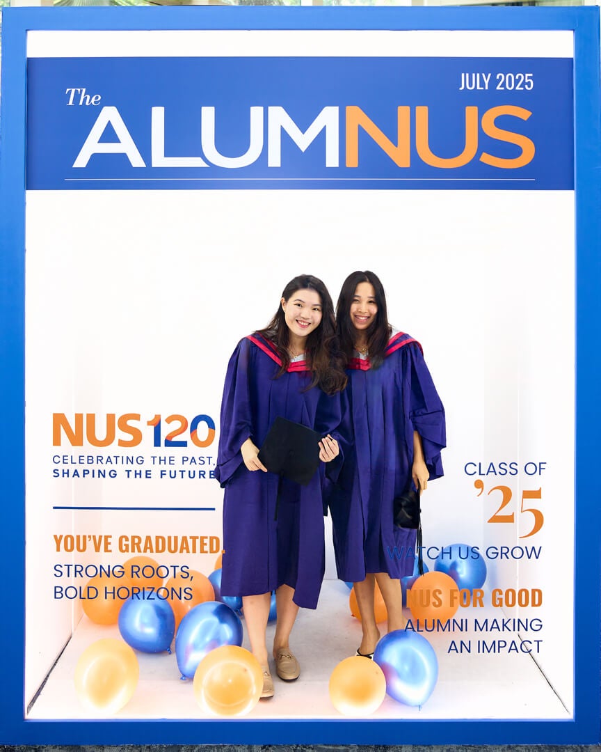 Graduates pose with their friends and family in the photo booth provided by the NUS Office of Alumni Relations.
