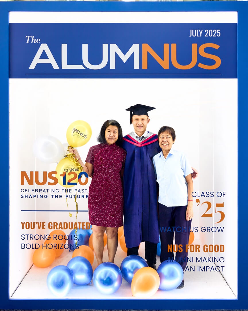 Graduates pose with their friends and family in the photo booth provided by the NUS Office of Alumni Relations.