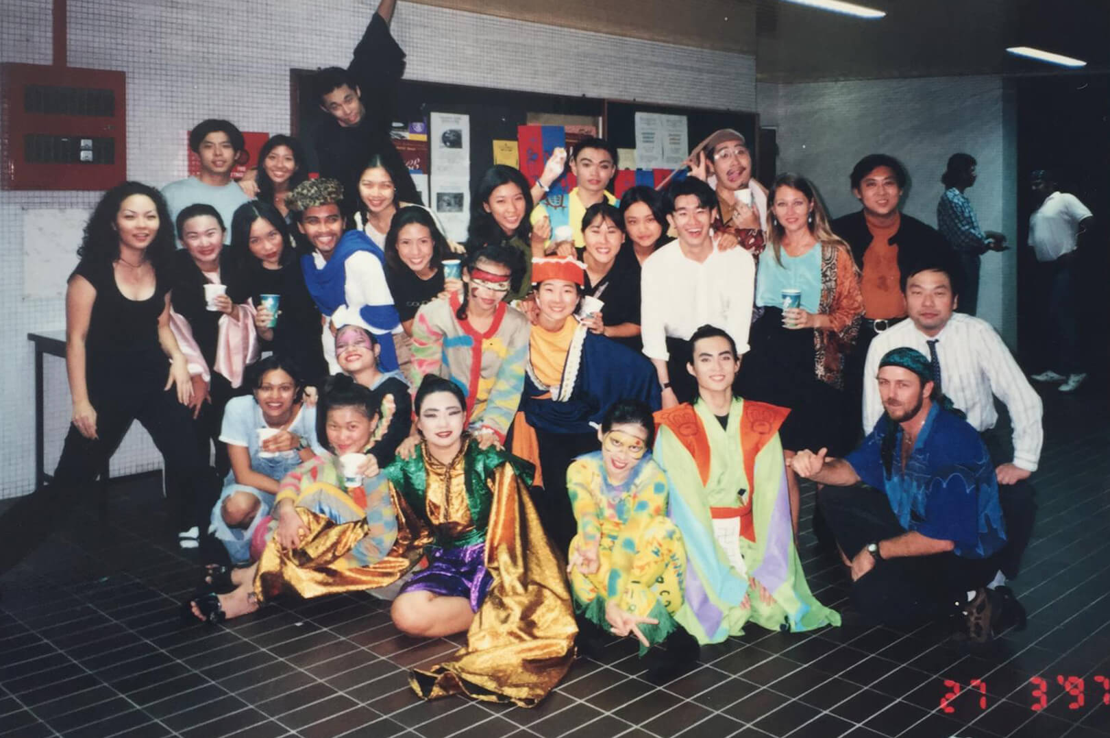 Dr Chen (seated, second from left) as dramaturg and physical comedy actor Zanni  in a Commedia dell Arte production with NUS.