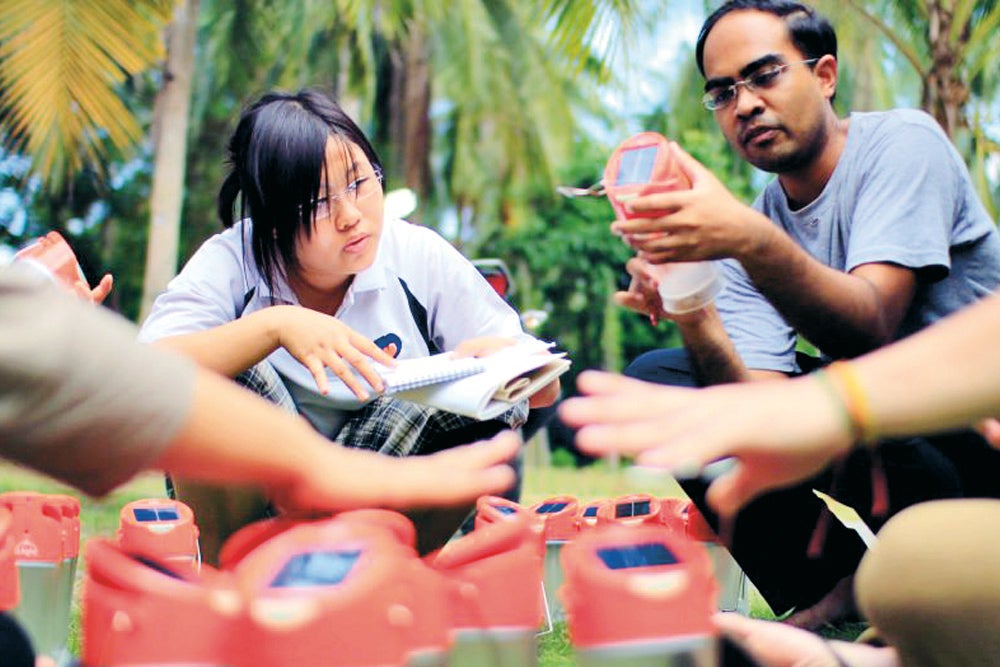 Mr Fairoz in the field conducting an inspection of the lamps to be distributed.